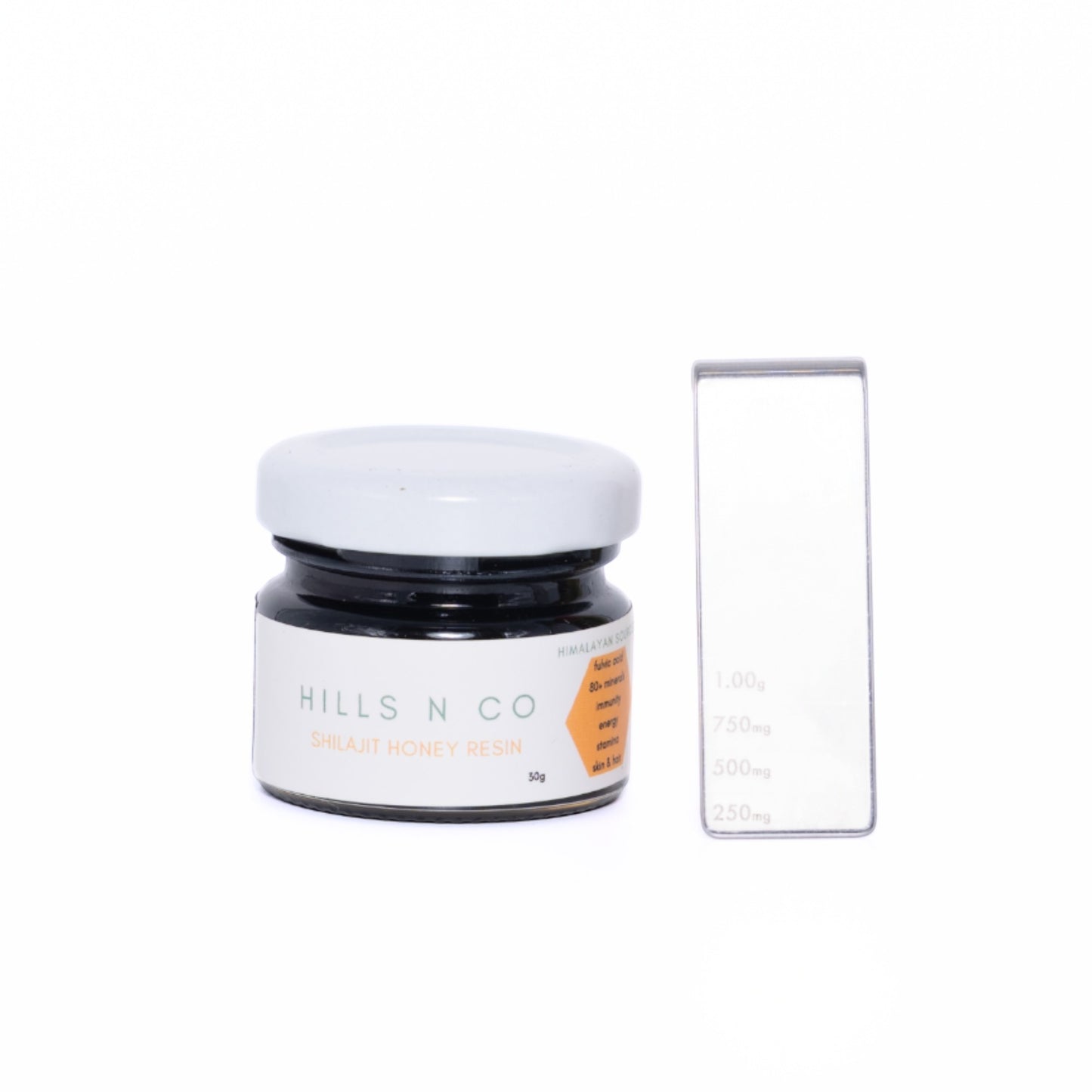 Hills N Co Shilajit Honey Resin, a dark resin in a glass jar with a white lid, infused with honey for energy and immunity.